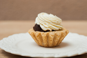 Cakes with white cream on gray background