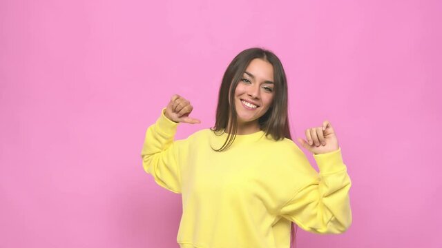 Young cute woman feels proud and self confident, example to follow