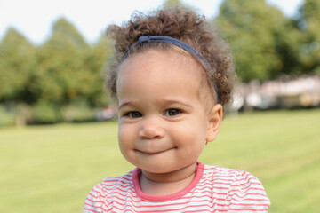 Portrait of a beautiful young afro girl outside