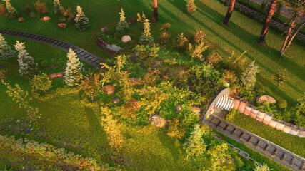 Aerial view of the children's railway in the park at dawn.