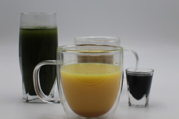 Turmeric Drink In Front of Natural Drinks