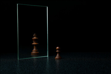 reassessment of their abilities. the pawn is reflected in the mirror like a king
