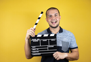 Russian man standing over insolated yellow background standing over isolated yellow background...