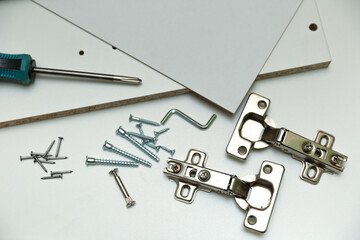 background with furniture fittings close up. assembling furniture concept