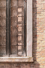 View of old building, bricked up window