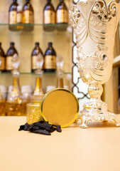 Incense con in golden jar with trophy, in shop