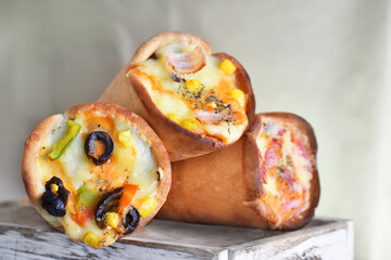 Organics and delicious pizza cones with a crunchy thin crust, lots of melted cheese, fresh vegetables and fine spices.