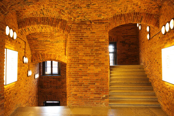 Fototapeta premium Corridor and steps made of red brick