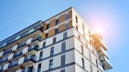 Architectural details of modern apartment building. Modern european residential apartment building complex. Sunset.