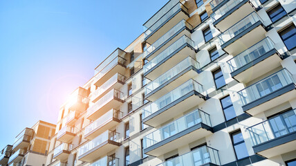 Architectural details of modern apartment building. Modern european residential apartment building complex. Sunset.