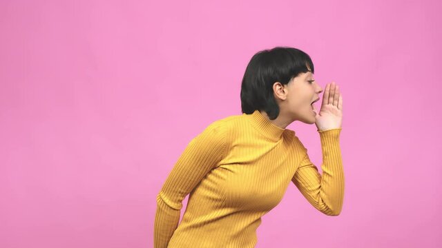 Young caucasian woman whispering gossip undertone, trying not to be heard