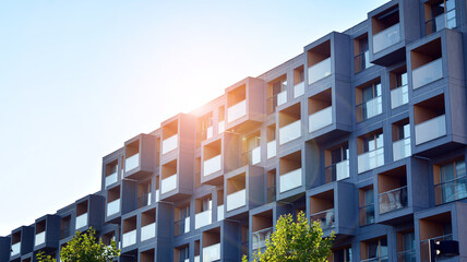 Architectural details of modern apartment building. Modern european residential apartment building complex. Sunset.