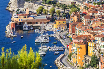 Beautiful top view of Villefranche-sur-Mer bay with boats and yacht. Villefranche-sur-Mer is luxury resort on the French Riviera at Mediterranean Sea, near Nice. France.
