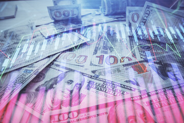 Multi exposure of forex chart drawing over us dollars bill background. Concept of financial success markets.
