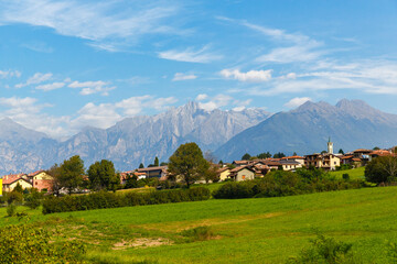 Fototapeta na wymiar Landscape Italian village on the background of the Alps.
