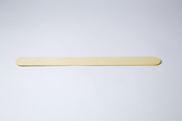 Popsicle stick on wood with white background