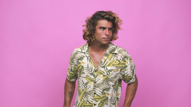 Young cool australian man confused, feels doubtful and unsure