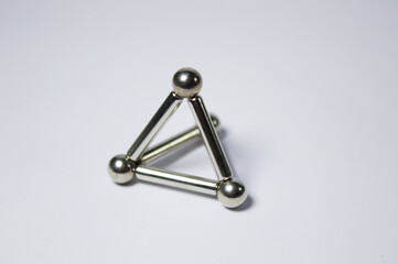 Metal frame with silvery spheres
