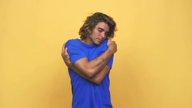 Young cool australian man hugs, smiling carefree and happy
