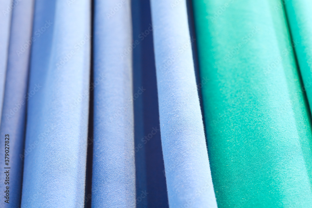 Poster abstract background of blue turquoise green. abstract texture of fabric or textile material of blue 