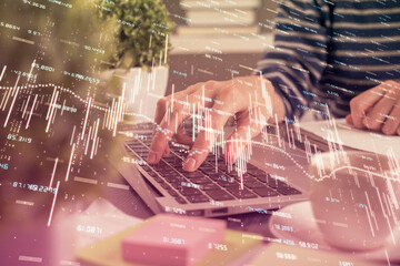Double exposure of woman hands typing on computer and forex chart hologram drawing. Stock market invest concept.