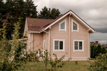 Modern wooden cottage with garden.