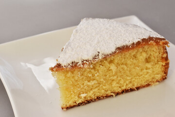 Fluffy lemon cake with a caramel and glass sugar covered, perfect dessert for a sunny day with a ice tea.
