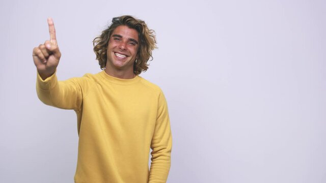 Young cool australian man showing number one with finger