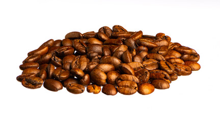 Roasted coffee beans lie in a small heap isolated on white background