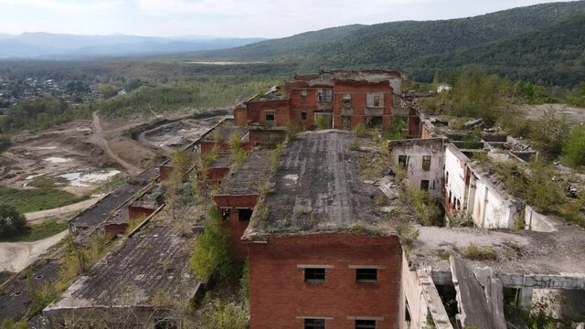View from above. Abandoned tin mining plant in Russia. Flying over the permitted buildings of the mining and processing plant in Kavalerovo