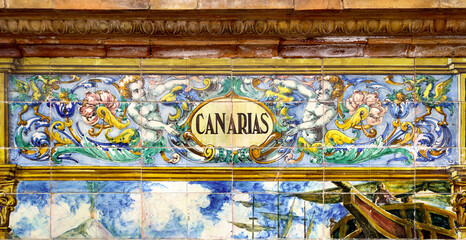 Tile with the name of the spanish Canary Islands on ceramic  with a colorful decoration located in Spain Square in Seville