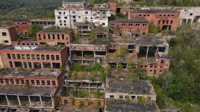 View from above. Abandoned tin mining plant in Russia. Flying over the permitted buildings of the mining and processing plant in Kavalerovo