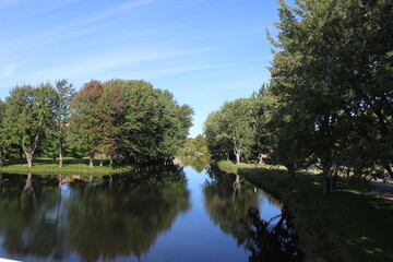 Fototapeta na wymiar Reflection on River in Plessisville, Qc