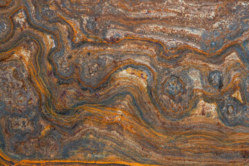 metal surface with curly rust, stains of different degrees of oxidation