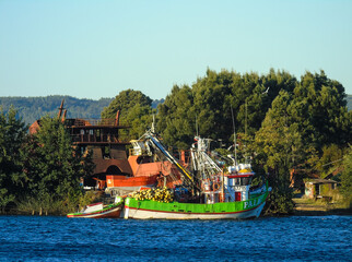 Fototapeta na wymiar Wrecks and fishing boats close to Valdivia in the south of Chile