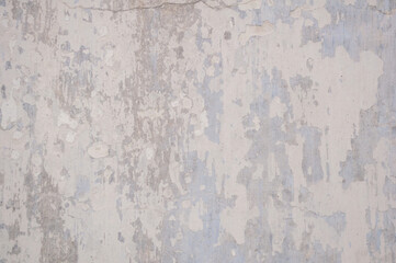 Alter grauer Wandhintergrund. abblätternde Farbe. Foto
