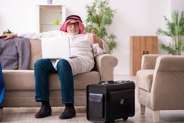 Old arab businessman preparing for business trip