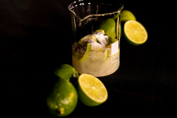 Fototapeta na wymiar Brazilian Caipirinha. Lemon, ice, sugar and cachaça. Fruit cocktail with alcohol. 