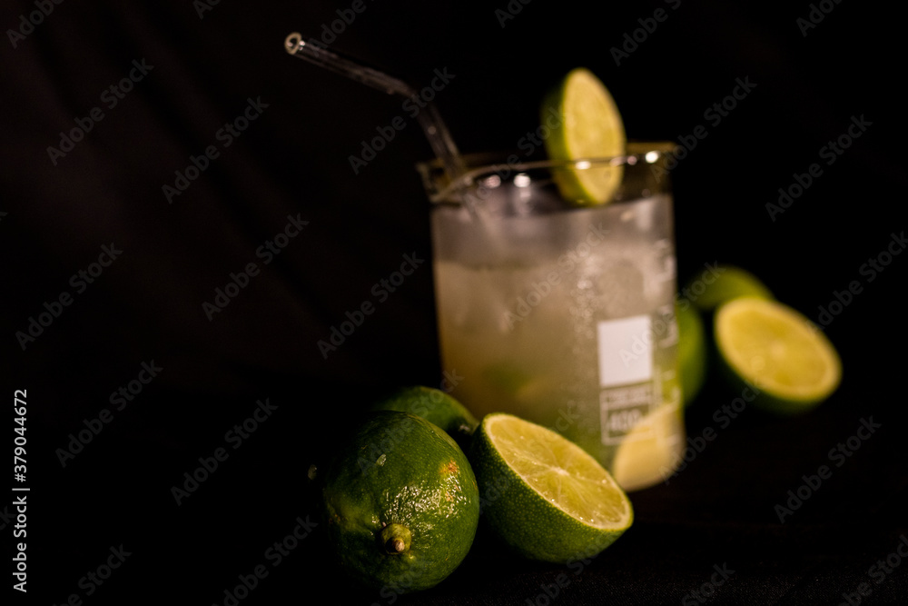 Wall mural Brazilian Caipirinha. Lemon, ice, sugar and cachaça. Fruit cocktail with alcohol. 