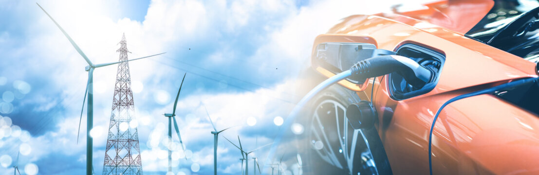 Double exposure of electric car charge battery with wind turbine pole and blue sky blur bokeh on panoramic background. idea nature electric energy to generate electricity. Green energy eco concept.