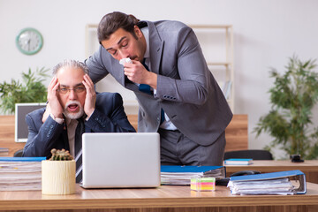 Two employees in pandemic concept at workplace