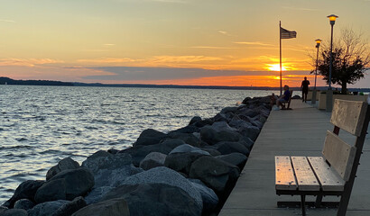 sunset on the lake pier rock harbor