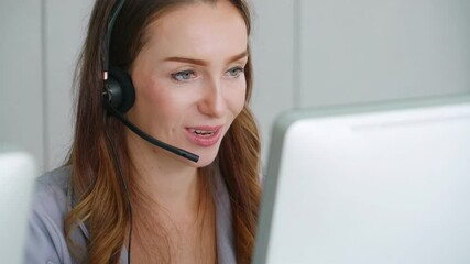 Business people wearing headset working in office to support remote customer or colleague. Call center, telemarketing, customer support agent provide service on telephone video conference call.