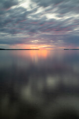 Beautiful golden hours sunset at Lake Superior summer Michigan, Long exposure cloud