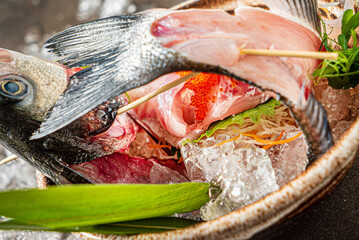 Delicious fresh fish on dark  background
