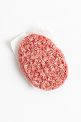  Raw minced homemade cutlets, on the white background