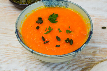 Autumn delicious food, hearty pumpkin soup top view, healthy nutrition on autumn dinner, the concept of thanksgiving day