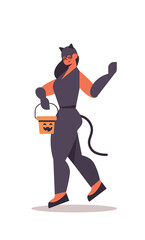 cute girl in cat costume holding bucket with pumpkin happy halloween party celebration concept flat full length isolated vertical vector illustration