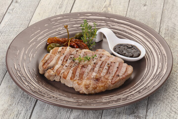 Grilled pork steak with pepper sauce