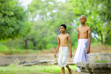 a priest child walking at forest